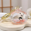 Pink liquid quicksand panda keychain with golden metal clasp for bags and gifts - Single Keychain Style / Pink