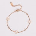 Detail of rose gold clover bracelet with lobster clasp and adjustable link chain - Rose Gold