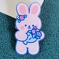 Pink cartoon bunny acrylic brooch with colorful flowers and blue bouquet detail - Bouquet Rabbit