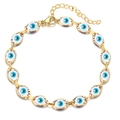 Golden Evil Eye link bracelet with blue resin eye charms and adjustable lobster clasp closure - Gold Base Cyan
