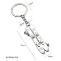 Silver winter sports snowboard keychain with snowflake pattern and double ski poles - Double Skis (Silver)