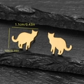 Minimalist gold cat stud earrings for women on elegant black slate stone background - Cat Gold