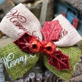 Macro detail of Christmas bow with Merry Christmas ribbon and red sequin leaf decor - Three-color Linen-look No Bell Style 2