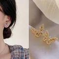 Elegant hollow butterfly stud earrings set with sparkling zircons in gold and silver finish - Butterfly Design / Gold