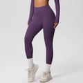 Detail of high-waist purple yoga leggings with supportive tummy control waistband - Dark Purple