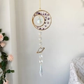 Handmade suncatcher wind chime featuring purple crystal stones and golden metal ring - Amethyst