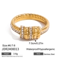 Macro detail of 18k gold plated stainless steel twisted ring with sparkling zircons - Gold Twist Rope Texture Rhinestone Ring (JDR2408013)