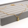 Macro view of gold stainless steel necklace featuring a polished capital letter S pendant - S / Gold