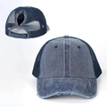 Detail view of washed denim ponytail baseball cap with breathable mesh and distressed brim - Navy Blue