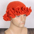 Orange knit ruffle beanie hat featuring hand-crocheted wavy edges on model - Adult 56-59cm / Iron Red