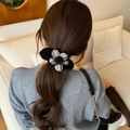 Chic black and checkered knit flower hair clip for elegant buns and ponytail styling - Black Flower
