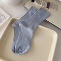 Light blue cotton knit crew socks with ribbed texture in a lifestyle aesthetic display - One Size / Fog Blue