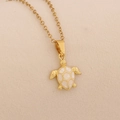 Detail shot of golden sea turtle pendant featuring white shell inlay on a gold chain - White Sea Turtle Necklace (2#White)