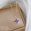 Detail of gold clover necklace with purple stones and white crystals on jewelry box - Purple Clover Pendant Necklace (J118)