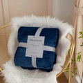 Dark blue coral fleece blanket with herringbone texture tied in a grey gift ribbon - Deep Blue