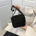 Minimalist black faux fur crossbody bag for women with adjustable strap and plush finish - Black