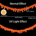 Orangefarbene fluoreszierende Sternengirlande mit Neoneffekt für Partys unter UV-Licht - 2 Meter / Neon Macaron Orangen-Gelb Stern Girlande