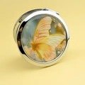 Miroir de poche argenté en métal avec motif papillon orange et décorations florales - Papillon Jaune