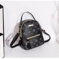 Detail of a mini black backpack with grey floral heart pattern and gold metal hardware - Black