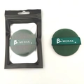 Green MERAK round makeup sponge puff with black packaging on a clean white background - Dark Green Round (Merak)