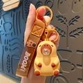 Cute yellow capybara keychain with a brown braided strap and bubble nose detail - Khaki Bubble Capybara