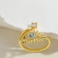 Detailed shot of golden adjustable evil eye ring with blue enamel and cubic zirconia - Royal Blue Zirconia