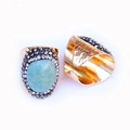Detail showing the hammered golden texture and inlaid green agate gemstone on the ring - Green Aventurine