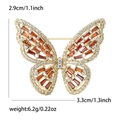 Elegant gold butterfly brooch with orange zircon stones and size specifications - Red