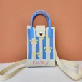 Detail of knitted mobile phone bag with blue stripes and lucky text embroidery - Striped Bow (Blue)