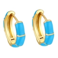 Detail of gold huggie hoops featuring turquoise enamel segments and a polished finish - Blue