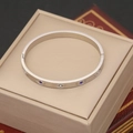 Macro shot of silver evil eye bangle with blue stones in a beige jewelry box - Oval Enamel Zircon Style (6#)