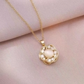 Close-up of golden spinning flower necklace pendant with white gemstone and zircons - X0625 Gold Cat's Eye Rotating