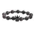 Detailed close-up of 8mm tiger eye stone beads with a black crown charm on the bracelet - Flash Stone (Labradorite)