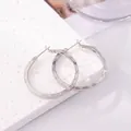 Elegant silver hoop earrings featuring three parallel textured lines and a pin closure - E-083---Platinum