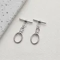 Macro view of silver 14K plated metal OT toggles for DIY necklace and bracelet jewelry - Style F Oval Link / White Gold