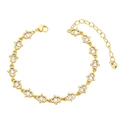 Detail of Hamsa hand bracelet in gold finish with zircon stones and a heart charm - Hamsa Hand