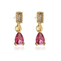 Detailed macro view of 18K gold plated earrings with pink teardrop and rectangular stones - Pink