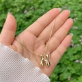 Polished 18K gold plated letter H pendant necklace with puffy balloon style in hand - Gold N