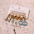 Three pairs of gold stainless steel earrings with Clover, Hamsa, and Evil Eye charms - Style 11