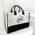 Canvas tote bag in beige and black featuring a floral wreath letter M initial design - No Zipper Style-Open Tote / Beige Black-Letter M