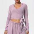 Detail of wrap tie-front yoga top and drawstring wide-leg pants in soft mauve - Lavender