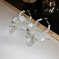 Detailed close-up of French vintage gold hoops with white pearls and silk flower tassels - 16# Pearl Hoop With White Simulation Petals (HE1967)