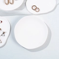 Irregular white cloud plaster tray with golden jewelry displayed on linen fabric - Irregular Circle