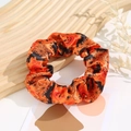 Detail of Halloween scrunchie with pumpkin and bat patterns on high-quality satin fabric - Halloween #7 (Orange Black Pumpkin Spiderweb)