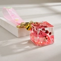 Macro shot of miniature resin house keychain with dried flowers and pink sequins - Rainbow Rope+House+Bell / Rose Red