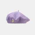 Detail view of purple wool beret featuring a delicate banana embroidery on the side - One Size / Light Purple