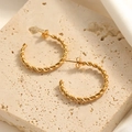 Elegant gold twisted rope hoop earrings displayed on a natural beige stone surface - Twisted Rope C-Shape Style (E126)