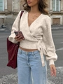 Detail of elegant cream v-neck wrap knit top with side tie design and long sleeves - S / Oatmeal