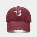 Close-up of vintage washed burgundy baseball cap featuring detailed white cow embroidery - Adjustable / Burgundy
