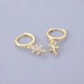 Detail view of gold gecko earrings with white zircon accents on a neutral backdrop - Gecko - Gold